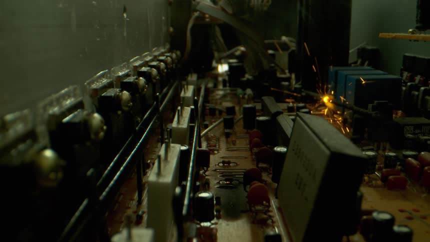 A circuit board with a wire that is sparking