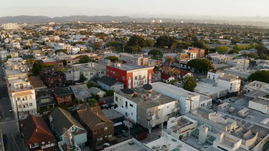A neighborhood suburb of a city stretches into the distance