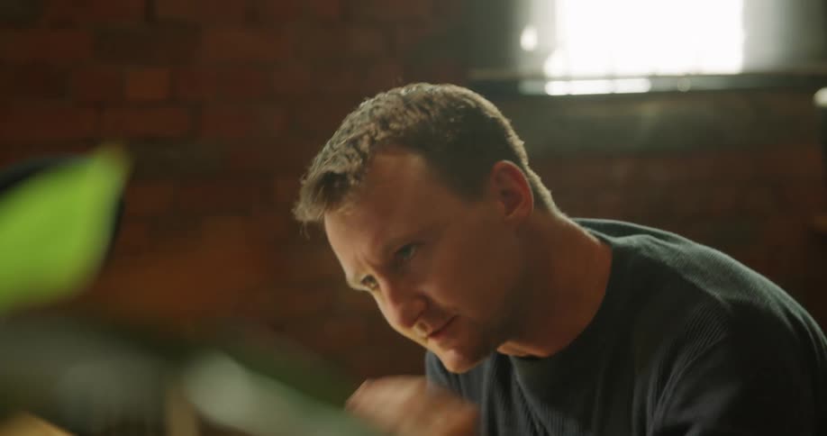 Man gestures and smiles as he converses