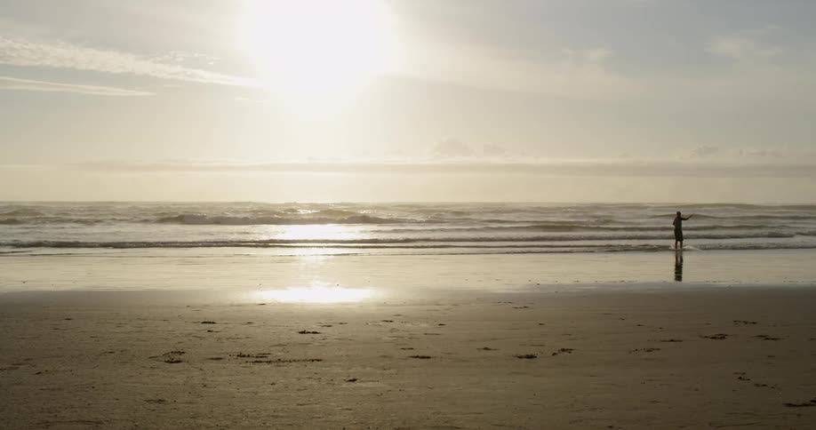 A person runs on the beach