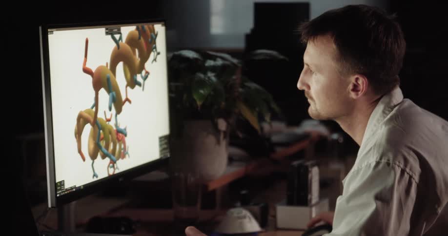 Doctor sitting at the desk uses desktop in the office