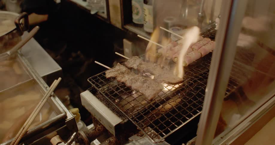Food is cooked in crowded kitchen