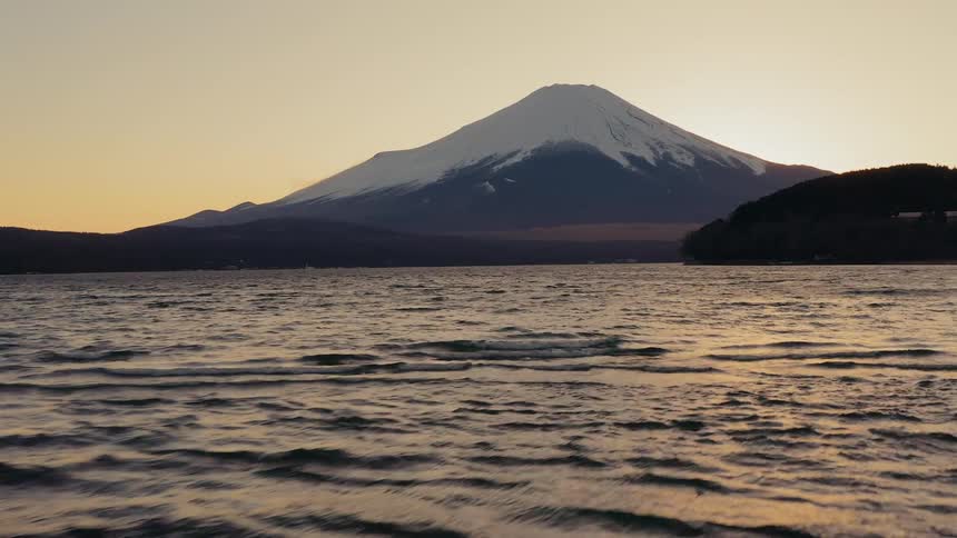 Aerial view of lake in front of mount fuji in japan at sunset
