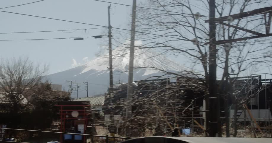 A moving shot of a mountain in the distance of a town