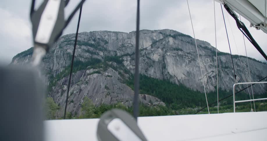 A boat stopped in front of a mountain
