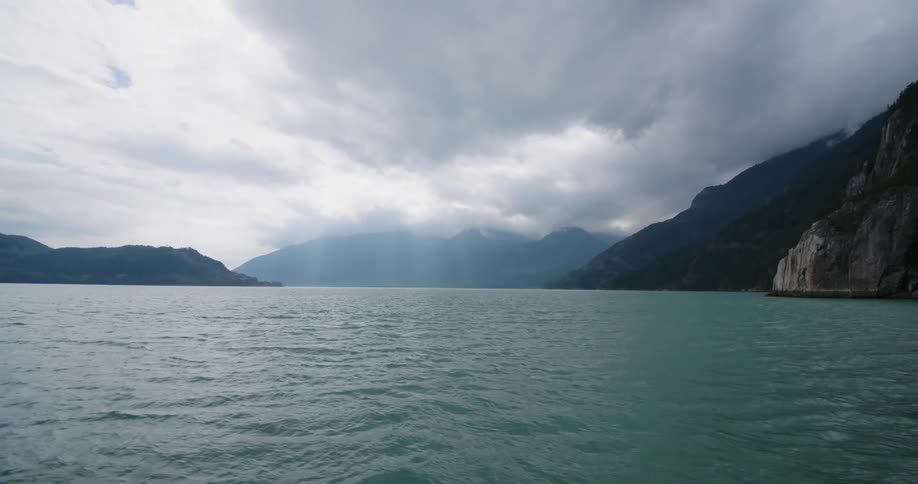 A lake fills a valley between mountains
