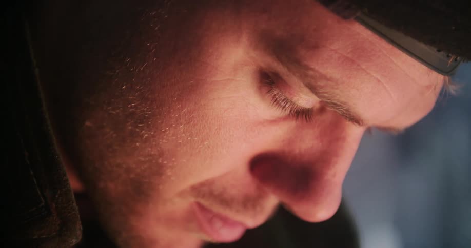 A man stares down