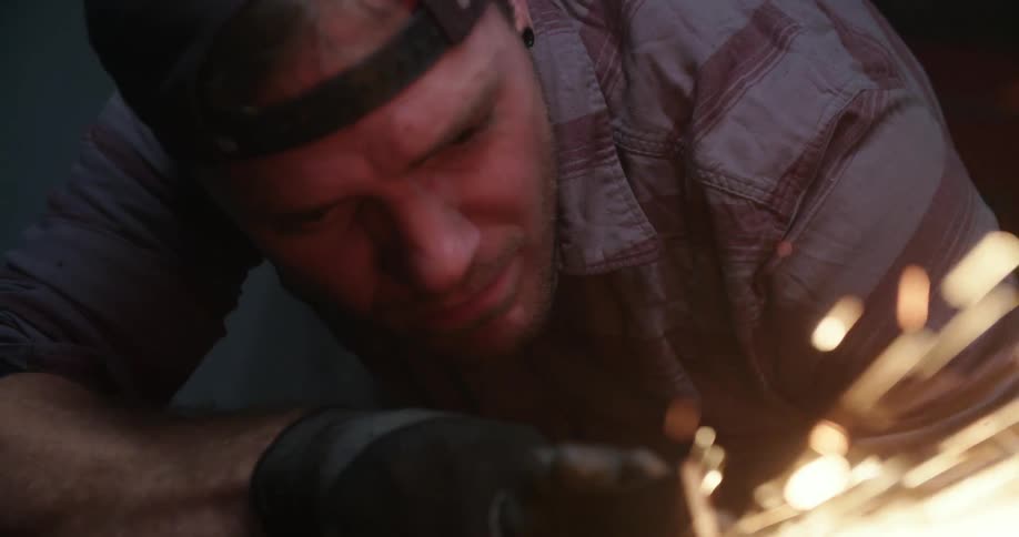 Sparks flying as a man welds