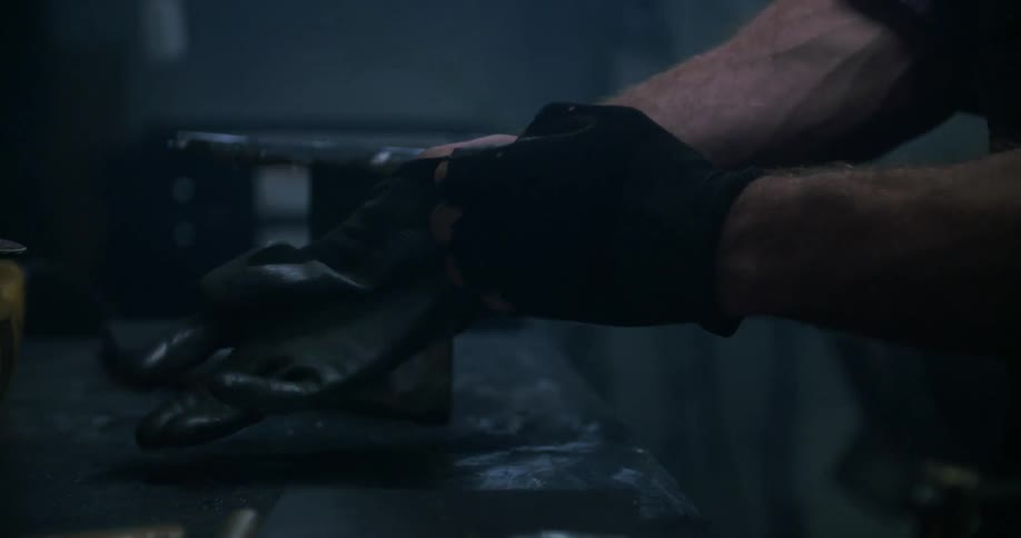 A man puts gloves on