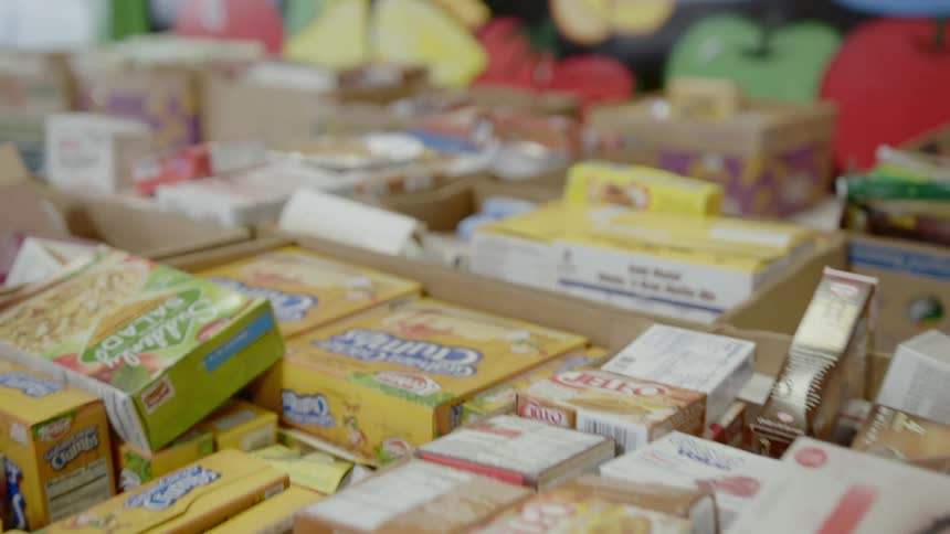 Boxes of food sit on a table