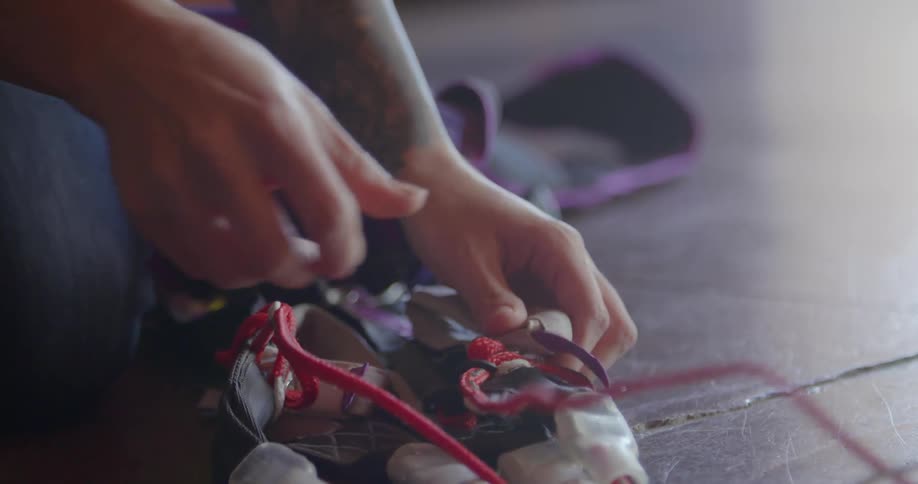 A man ties electrical cords together