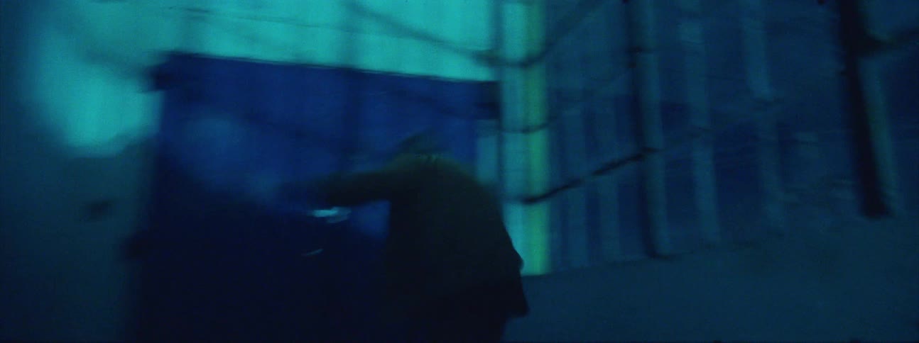 A person spins around running in the hall