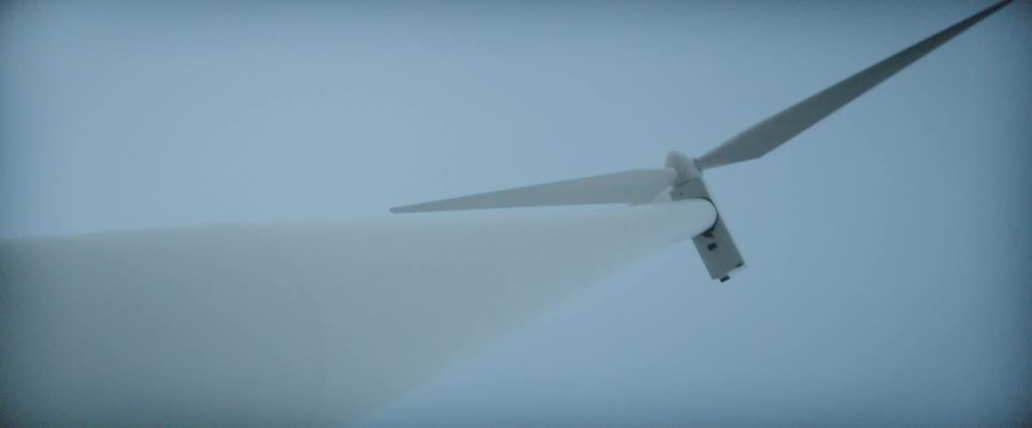 The windmill reaches high into the sky