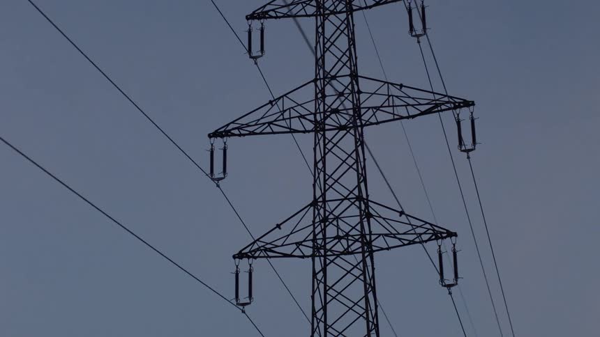 A utility tower holds multiple power lines