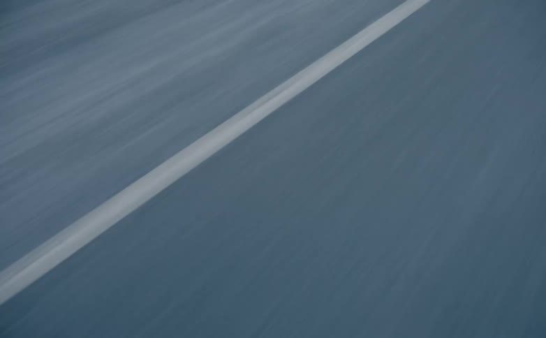 A white line is in the middle of the road