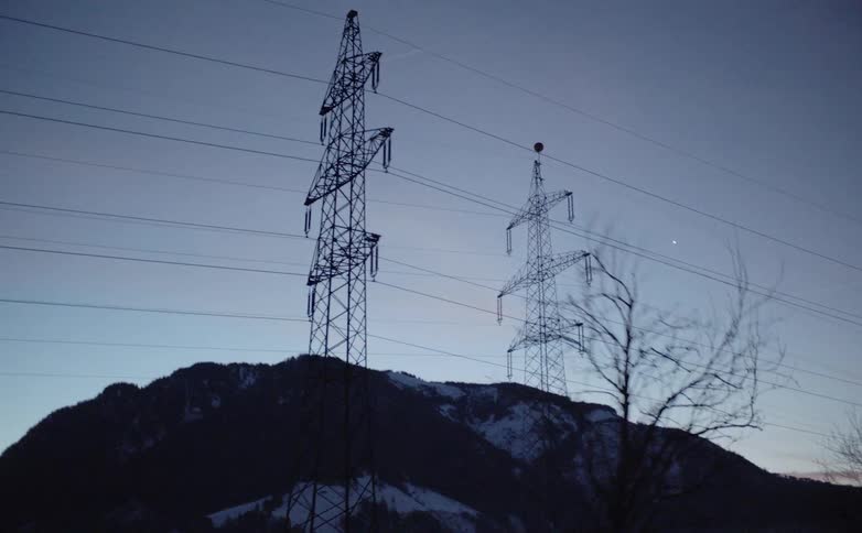 Electrical towers in front of a factory
