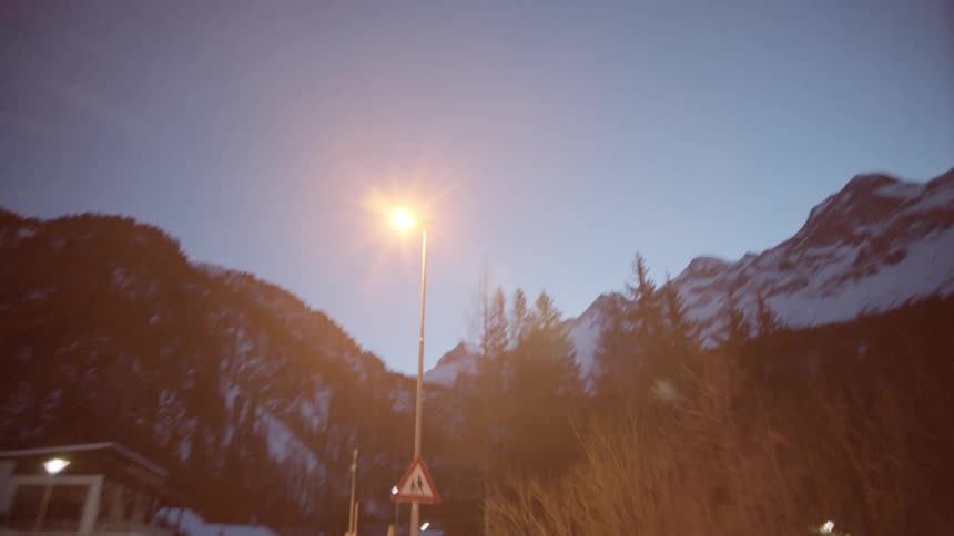 A building at the the base of a mountain range