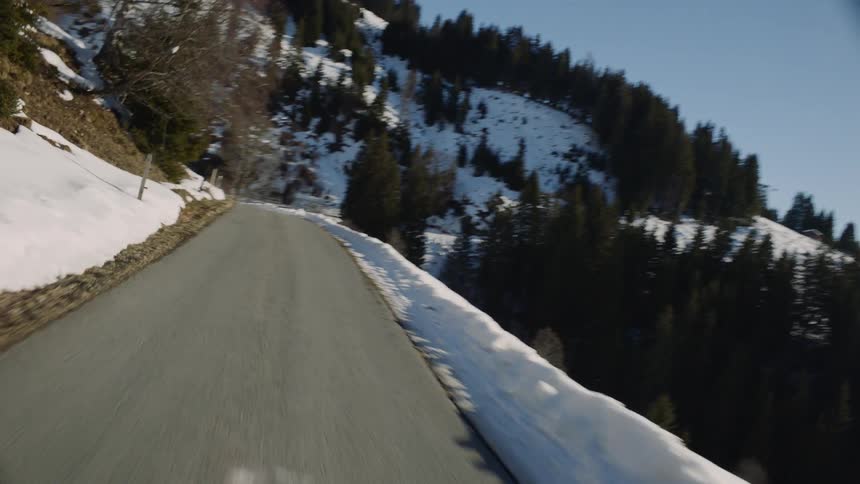 A road runs along the side of a mountain