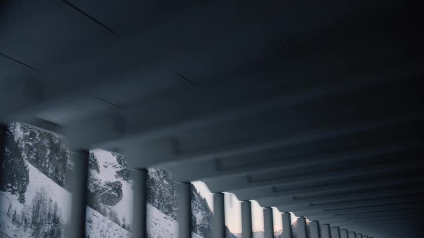 A tunnel at the base of a mountain