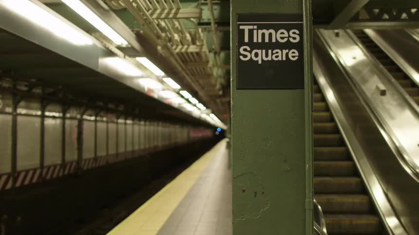 Empty subway station at times square while escalator is going down