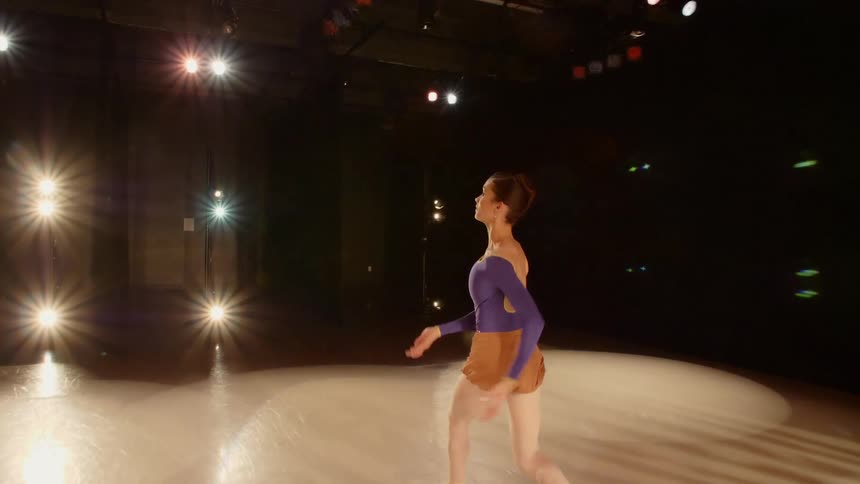 Ballerina runs and leaps across stage and enters backstage