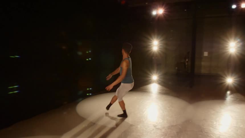 Male ballerina performs ballet on the stage
