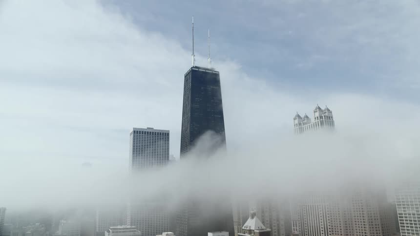 Fog surrounds tall buildings in Chicago