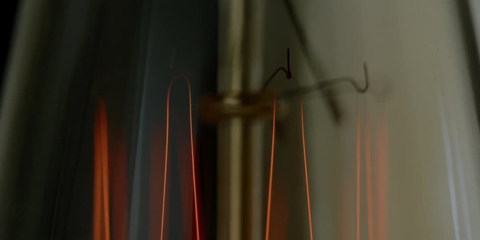 Coils hanging on hooks light up