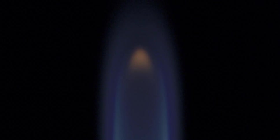 Flame flickering against a black background