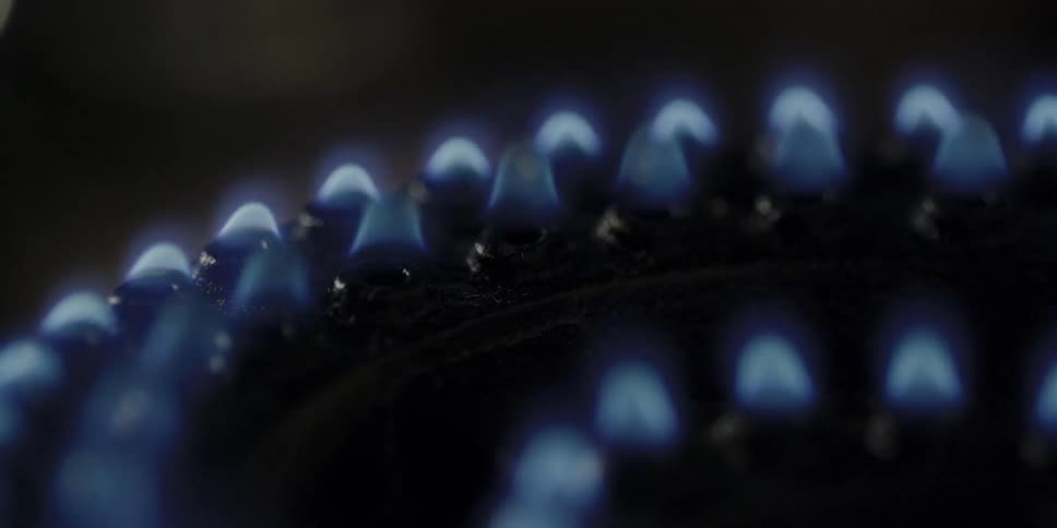 The burner flares on and off