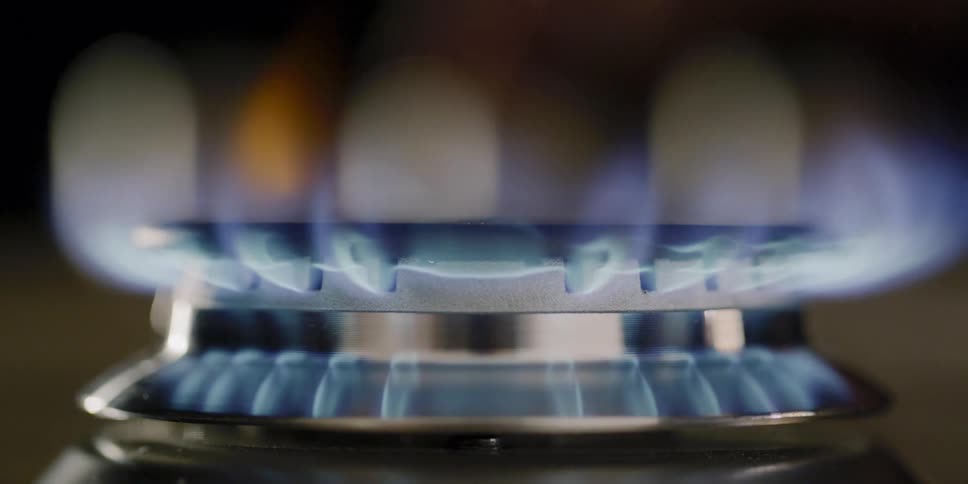 Person lights gas burner