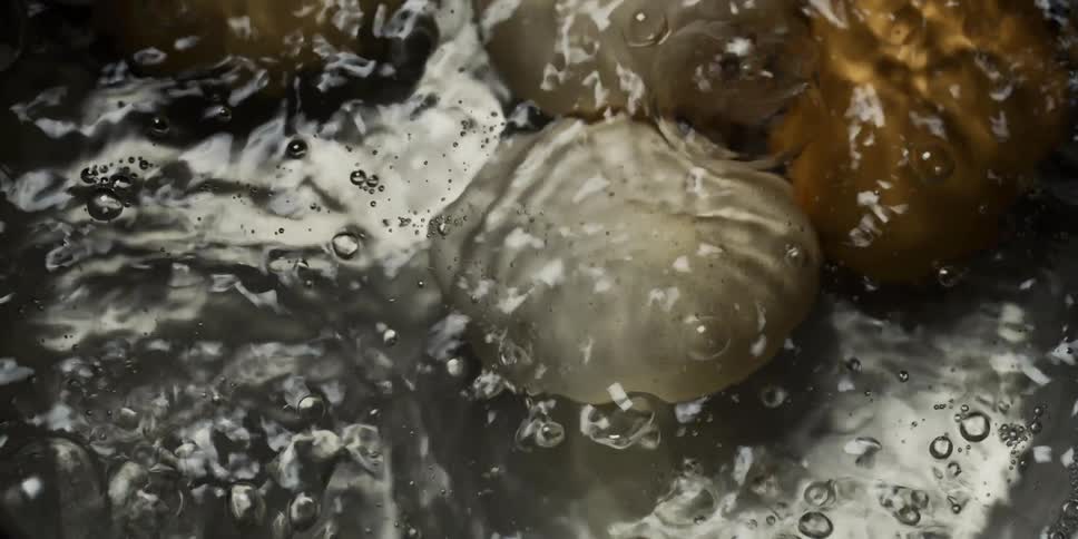 Eggs cook in boiling water