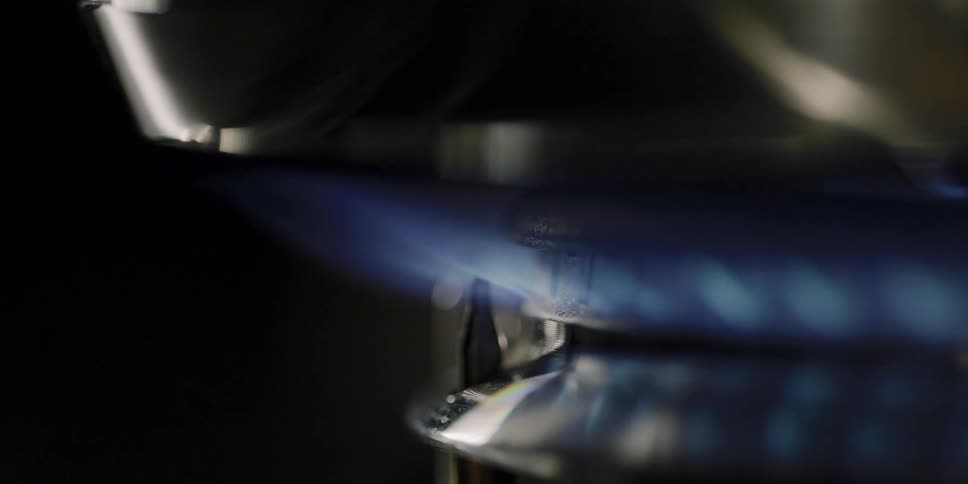 A burner on a stove lights up
