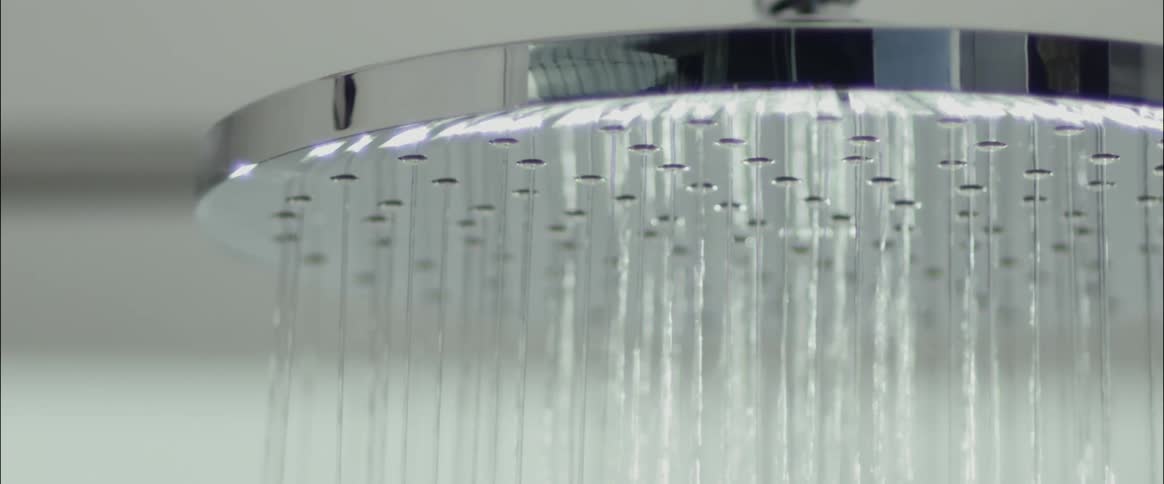 Water falls out of a shower head