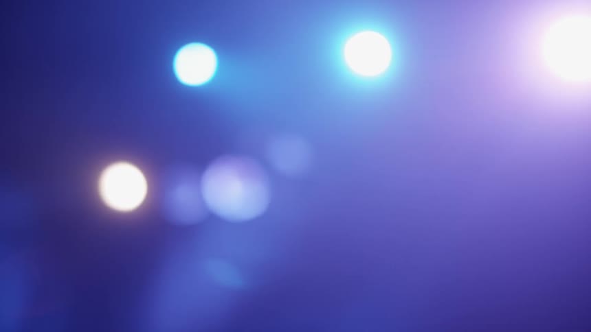 Colored hanging lights shining in an otherwise dark room