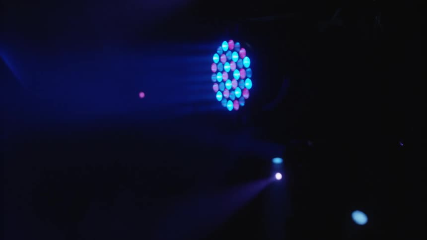 The strobe light is shining in the dark room