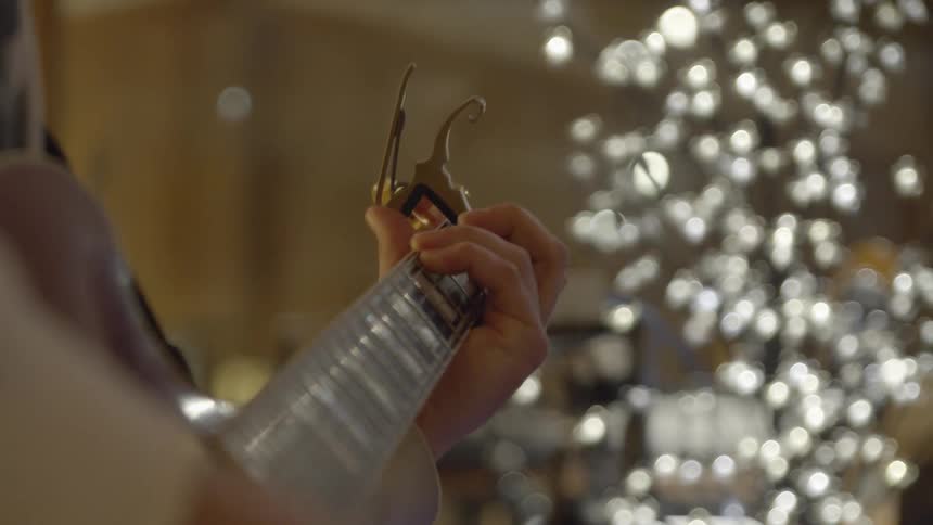 A rosewood neck guitar is held by its player