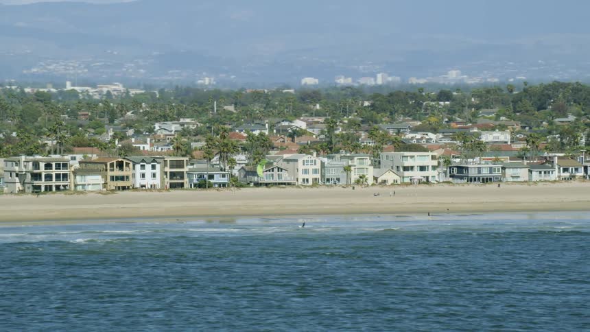 A person kite surfing on the beach