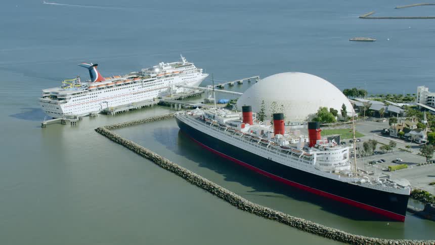 Aerial of carnival cruise ship docked next to rms queen mary in long beach