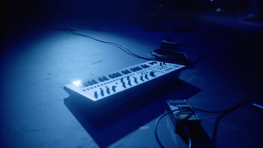 A small keyboard sit on the floor