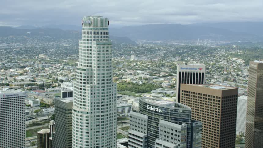 Aerial view of skyscrapers in city downtown on clear day