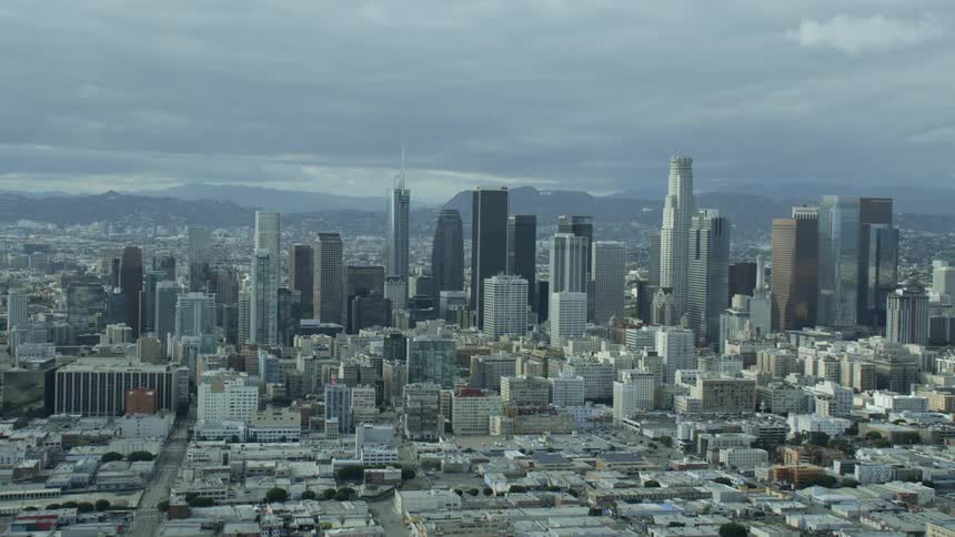 Aerial establishing shot of Los Angeles skyline with quiet streets during Covid-19