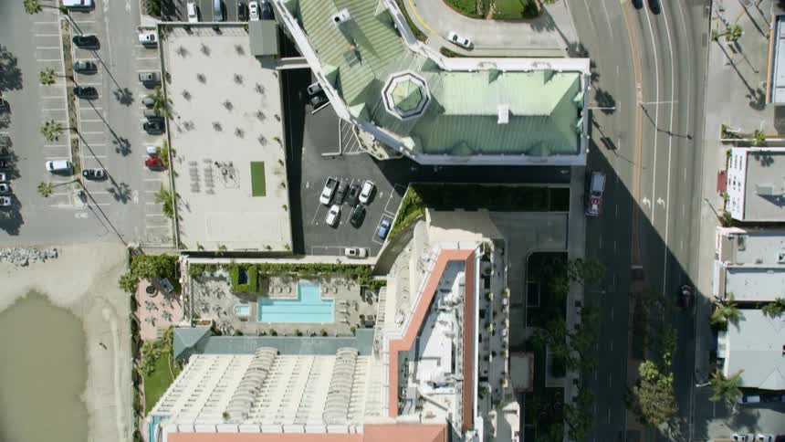 A multi lane highway is surrounded by tall buildings