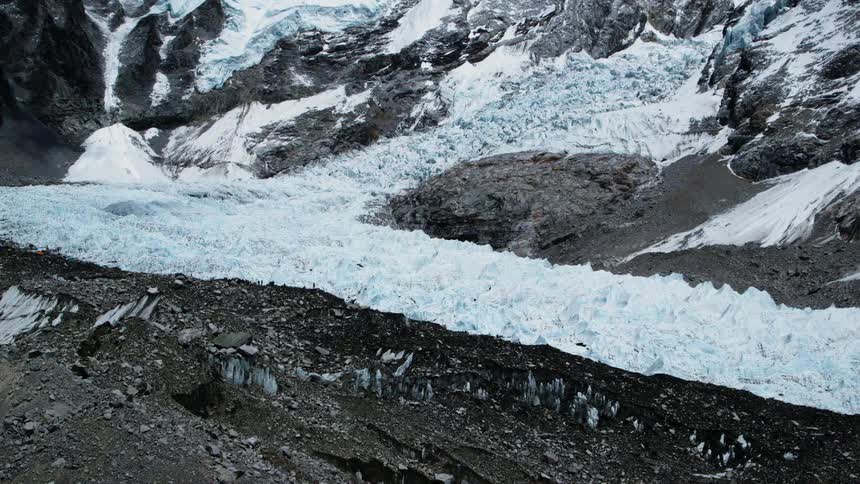 The hills on the mountain top are covered with ice