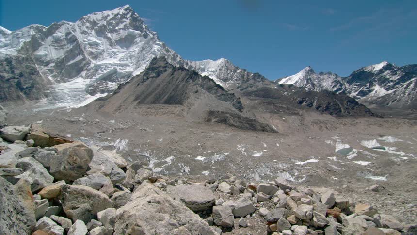A mountain range with rocks and snow