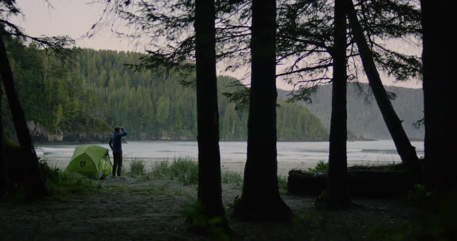 A person is camping by the lake
