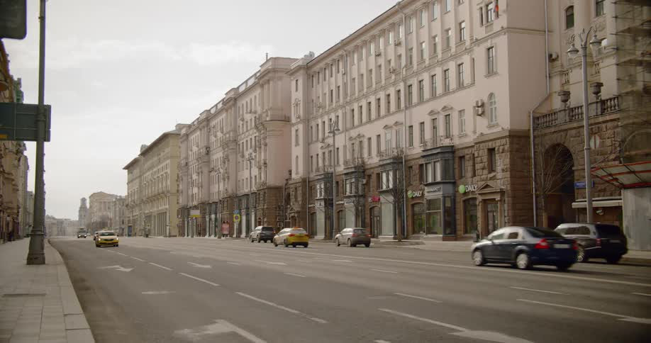 Cars driving down a street