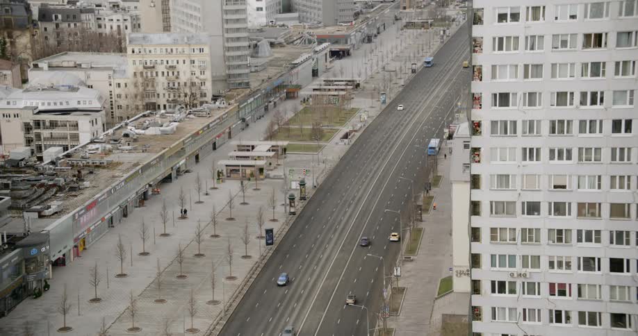 Few cars driving on city downtown freeway at day