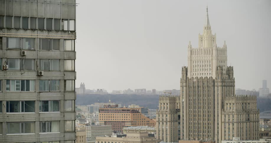 The city is filled with towers on a foggy day