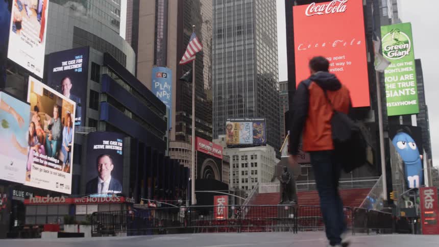 Video billboards fill a public space in a city